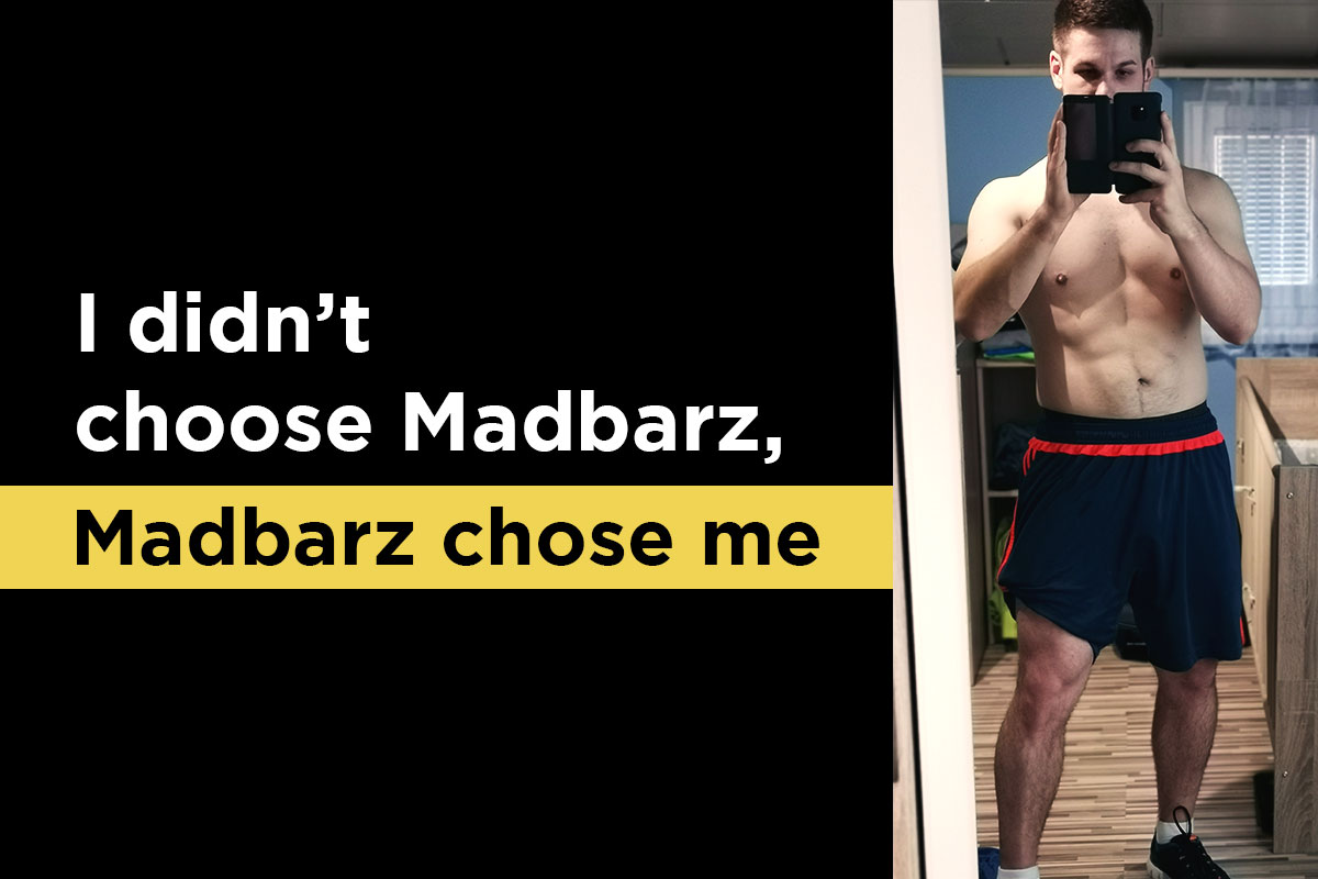Fit man in training equipement, torso naked, taking a selfie in the mirror using his phone. ''I didn't choose Madbarz, Madbarz chose me'' written on the left side next to the picture